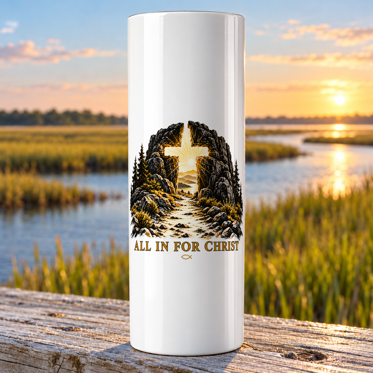 All In For Christ design on a white Hogg 20 oz skinny tumbler beside an Eastern North Carolina coastal marsh.