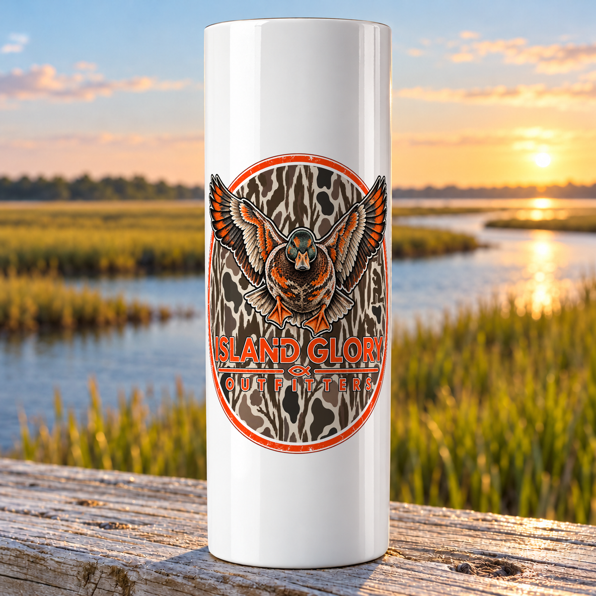 Duck Camo design on a white Hogg 20 oz skinny tumbler beside an Eastern North Carolina coastal marsh.