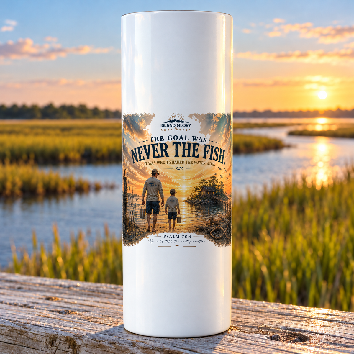 Never the Fish design on a white Hogg 20 oz skinny tumbler beside an Eastern North Carolina coastal marsh.