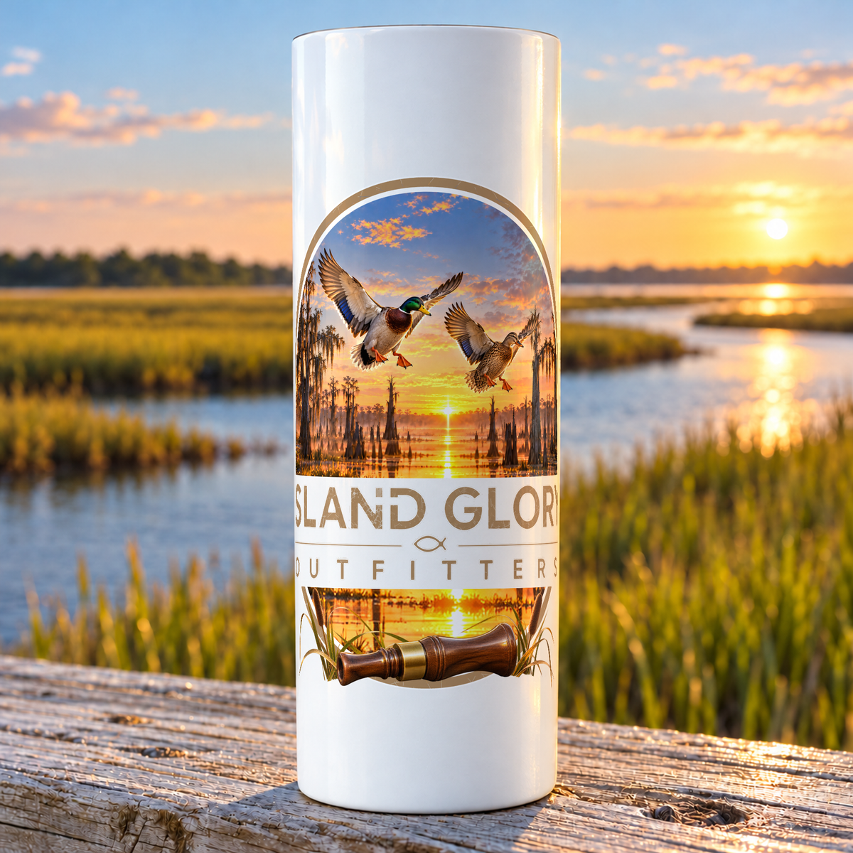 First Light — Mallards design on a white Hogg 20 oz skinny tumbler beside an Eastern North Carolina coastal marsh.