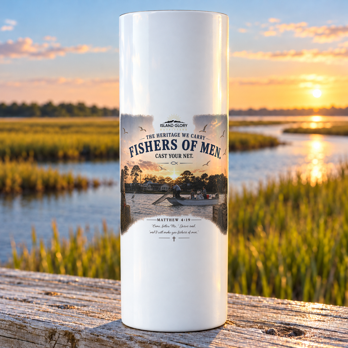 Fishers of Men design on a white Hogg 20 oz skinny tumbler beside an Eastern North Carolina coastal marsh.