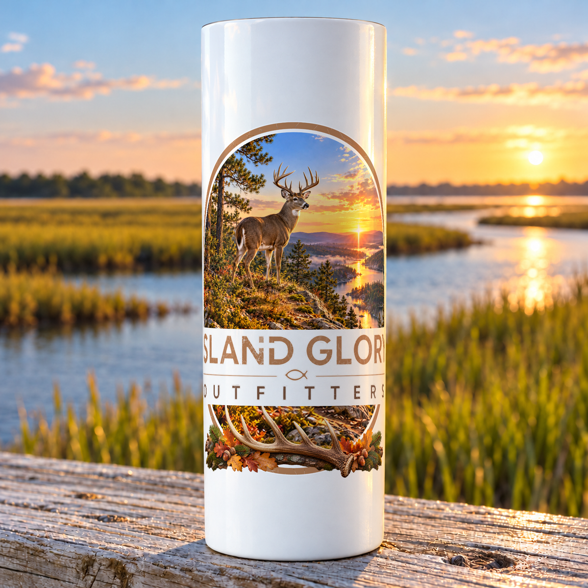 Whitetail Ridge design on a white Hogg 20 oz skinny tumbler beside an Eastern North Carolina coastal marsh.